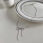 Minimalist Silver Bow Necklace - Image 5