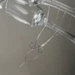 Minimalist Silver Bow Necklace - Image 3