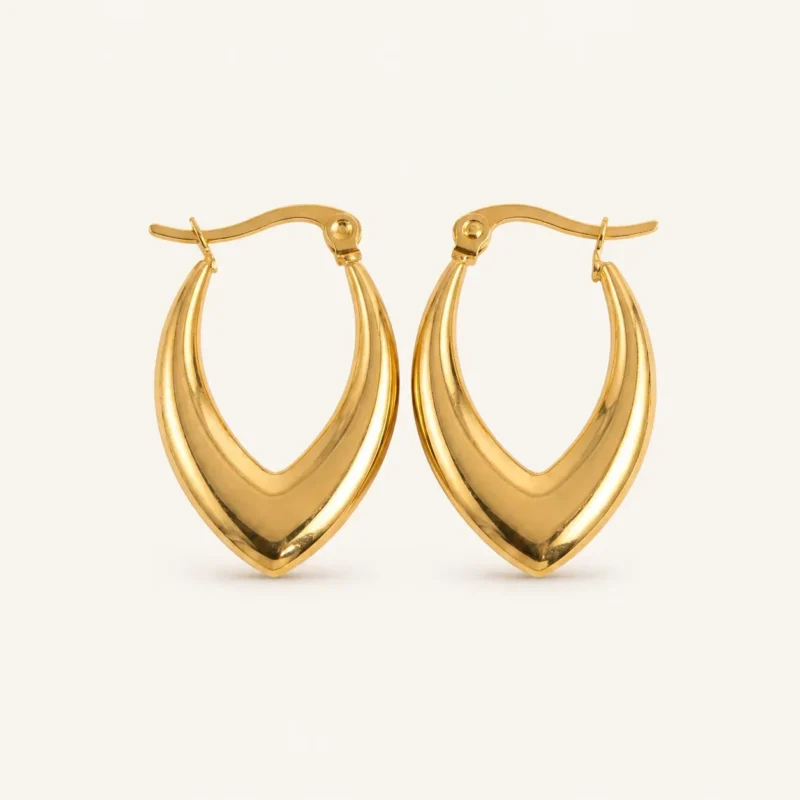 Pair of gold-plated stainless steel V-shaped hoop earrings with polished finish on a neutral background