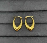 Pair of gold-plated stainless steel V-shaped hoop earrings with polished finish on a neutral background