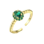 Gold-plated stainless steel open ring with a central oval green stone surrounded by smaller green gems and a twisted rope band.