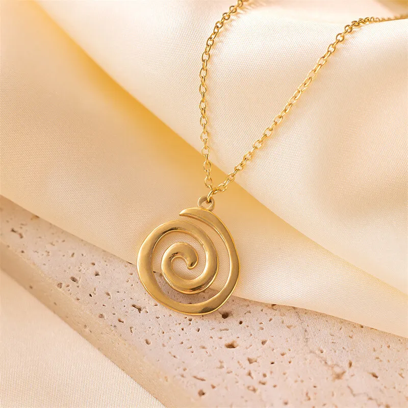 product-5 Stainless steel spiral pendant necklace in silver and gold finishes worn by a model