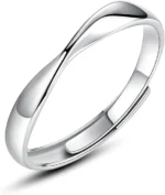 Silver stainless steel twisted mobius adjustable ring on lace background