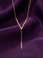 Gold-plated stainless steel Vertex V Lariat Necklace with geometric bar pendant on beige stone background